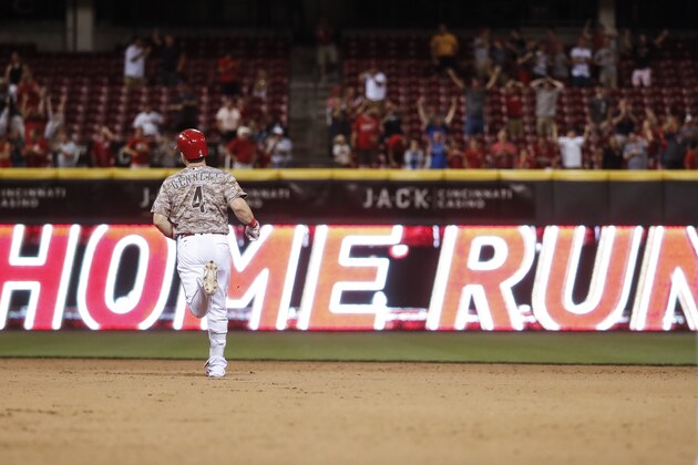 Cincinnati Reds' Scooter Gennett runs the bases after hitting a two-run home run and his fourth overall in the eighth inning of a baseball game against the St. Louis Cardinals, Tuesday, June 6, 2017, in Cincinnati. The Reds won 13-1. (AP Photo/John Minchillo)