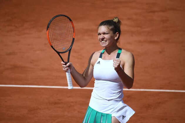 Romania's Simona Halep celebrates after winning her tennis match against Ukraine's Elina Svitolina at the Roland Garros 2017 French Open on June 7, 2017 in Paris.  / AFP PHOTO / Eric FEFERBERG        (Photo credit should read ERIC FEFERBERG/AFP/Getty Images)