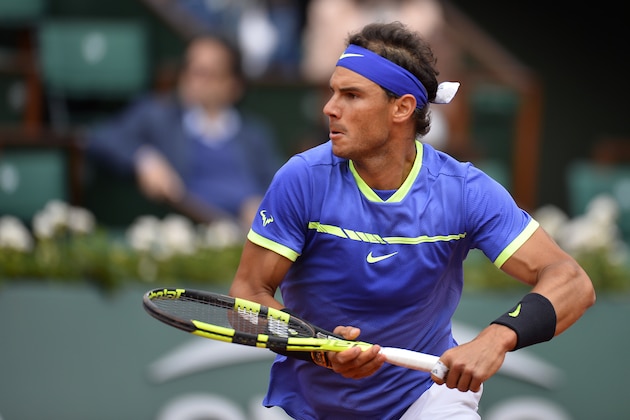 PARIS, FRANCE - JUNE 07:  Rafael Nadal of Spain plays a forehand during the men's singles quarterfinal match against Pablo Carreno Busta of Spain on day eleven of the 2017 French Open at Roland Garros on June 7, 2017 in Paris, France.  (Photo by Aurelien Meunier/Getty Images)