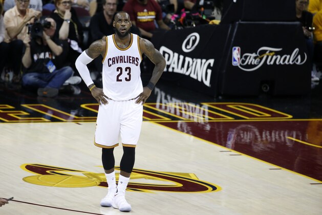 Cleveland Cavaliers forward LeBron James (23) looks to the scoreboard against the Golden State Warriors during the first half of Game 3 of basketball's NBA Finals in Cleveland, Wednesday, June 7, 2017. (AP Photo/Ron Schwane)