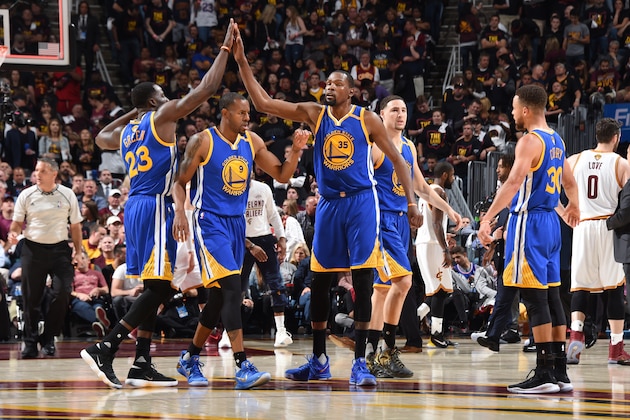 CLEVELAND, OH - JUNE 7:  Kevin Durant #35 and Draymond Green #23 of the Golden State Warriors high-five in Game Three of the 2017 NBA Finals on June 7, 2017 at Quicken Loans Arena in Cleveland, Ohio. NOTE TO USER: User expressly acknowledges and agrees that, by downloading and/or using this photograph, user is consenting to the terms and conditions of Getty Images License Agreement. Mandatory Copyright Notice: Copyright 2017 NBAE (Photo by Andrew D. Bernstein/NBAE via Getty Images)
