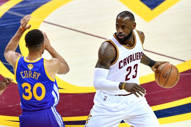CLEVELAND, OH - JUNE 07: LeBron James #23 of the Cleveland Cavaliers handles the ball against Stephen Curry #30 of the Golden State Warriors in the first quarter in Game 3 of the 2017 NBA Finals at Quicken Loans Arena on June 7, 2017 in Cleveland, Ohio. NOTE TO USER: User expressly acknowledges and agrees that, by downloading and or using this photograph, User is consenting to the terms and conditions of the Getty Images License Agreement.  (Photo by Jason Miller/Getty Images)