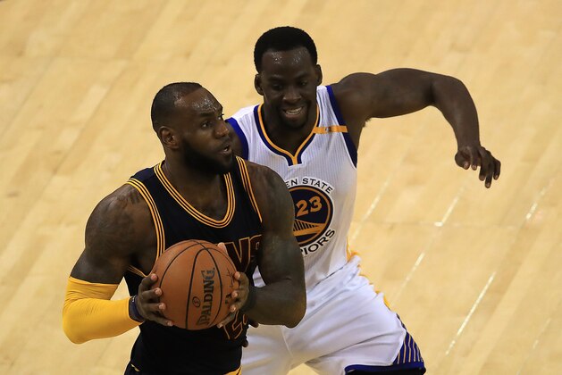 OAKLAND, CA - JUNE 01:  LeBron James #23 of the Cleveland Cavaliers is defended by Draymond Green #23 of the Golden State Warriors during the second half of Game 1 of the 2017 NBA Finals at ORACLE Arena on June 1, 2017 in Oakland, California. NOTE TO USER: User expressly acknowledges and agrees that, by downloading and or using this photograph, User is consenting to the terms and conditions of the Getty Images License Agreement.  (Photo by Ezra Shaw/Getty Images)