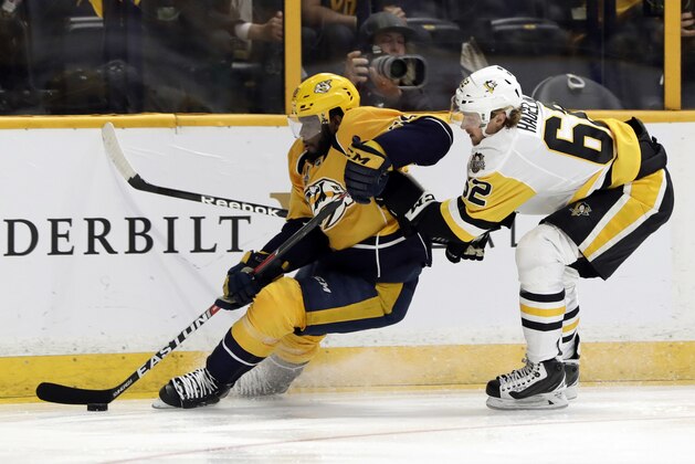 Nashville Predators defenseman P.K. Subban, left, tries to skate past Pittsburgh Penguins left wing Carl Hagelin, of Sweden, right, during the second period in Game 3 of the NHL hockey Stanley Cup Finals Saturday, June 3, 2017, in Nashville, Tenn. (AP Photo/Mark Humphrey)