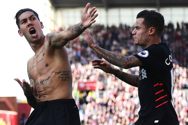STOKE ON TRENT, ENGLAND - APRIL 08: Roberto Firmino of Liverpool celebrates scoring his side's second goal with team-mate Philippe Coutinho during the Premier League match between Stoke City and Liverpool at Bet365 Stadium on April 8, 2017 in Stoke on Trent, England. (Photo by Chris Brunskill Ltd/Getty Images)