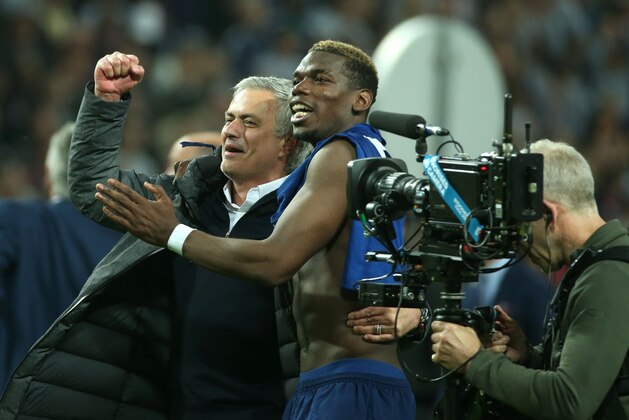 Manchester United's Portuguese manager Jose Mourinho (L) and Manchester United's French midfielder Paul Pogba celebrate after their team won the UEFA Europa League final football match Ajax Amsterdam v Manchester United on May 24, 2017 at the Friends Arena in Solna outside Stockholm. / AFP PHOTO / Soren Andersson        (Photo credit should read SOREN ANDERSSON/AFP/Getty Images)