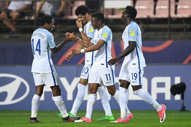 England's forward Ademola Lookman (C) celebrates his goal with teammates during the U-20 World Cup semi-final football match between England and Italy in Jeonju on June 8, 2017.  / AFP PHOTO / JUNG Yeon-Je        (Photo credit should read JUNG YEON-JE/AFP/Getty Images)
