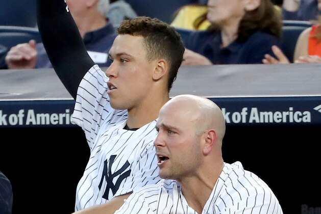 NEW YORK, NY - JUNE 07:  Aaron Judge #99 and Matt Holliday #17 of the New York Yankees react to teammate Gary Sanchez's RBI in the fourth inning against the Boston Red Sox on June 7, 2017 at Yankee Stadium in the Bronx borough of New York City.  (Photo by Elsa/Getty Images)