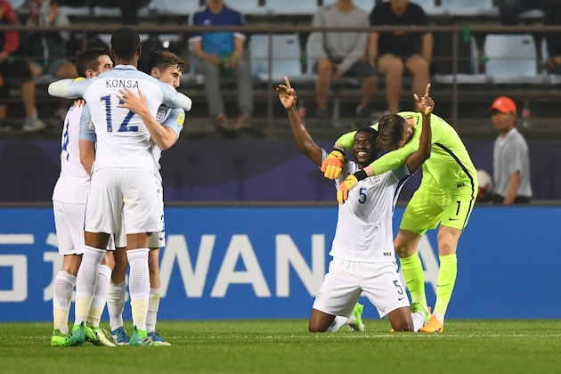 England's players (white) celebrate their victory during the U-20 World Cup semi-final football match between England and Italy in Jeonju on June 8, 2017.  / AFP PHOTO / JUNG Yeon-Je        (Photo credit should read JUNG YEON-JE/AFP/Getty Images)