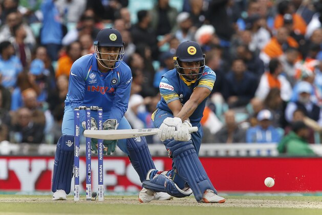 Sri Lankas Danushka Gunathilaka hits a reverse sweep shot during the ICC Champions Trophy match between India and Sri Lanka at The Oval in London on June 8, 2017. / AFP PHOTO / Ian KINGTON / RESTRICTED TO EDITORIAL USE (Photo credit should read IAN KINGTON/AFP/Getty Images) Sri Lankas Danushka Gunathilaka hits a reverse sweep shot during the ICC Champions Trophy match between India and Sri Lanka at The Oval in London on June 8, 2017. / AFP PHOTO / Ian KINGTON / RESTRICTED TO EDITORIAL USE (Photo credit should read IAN KINGTON/AFP/Getty Images)