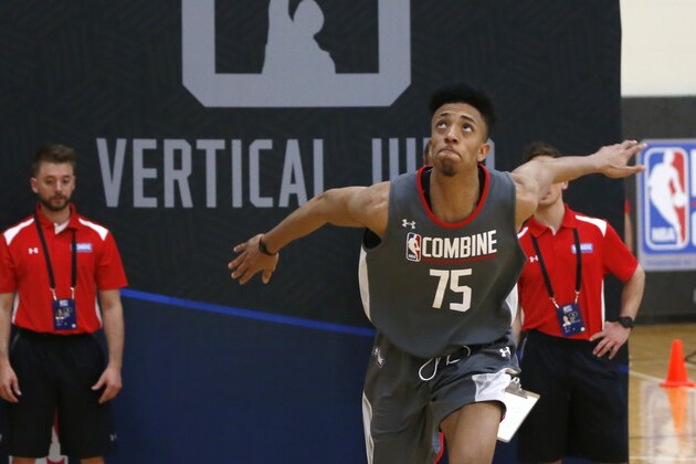 Jonathan Jeanne, from France, participates in the running vertical jump at the NBA basketball draft combine Thursday, May 11, 2017, in Chicago. (AP Photo/Charles Rex Arbogast)