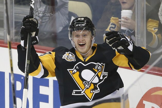 Pittsburgh Penguins' Jake Guentzel celebrates his first goal in the NHL on his first shot in his first NHL shift during the first period of an NHL hockey game against the New York Rangers in Pittsburgh, Monday, Nov. 21, 2016. (AP Photo/Gene J. Puskar)