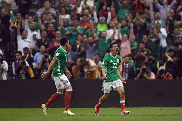 Mexico's Hirving Lozano (R) celebrates a goal he scored during their World Cup 2018 CONCACAF qualifiers football match against Honduras in Mexico City, on June 8, 2017. / AFP PHOTO / ALFREDO ESTRELLA        (Photo credit should read ALFREDO ESTRELLA/AFP/Getty Images)