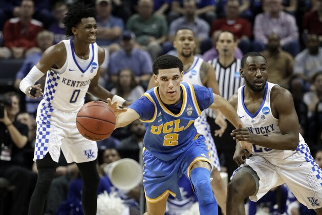 UCLA guard Lonzo Ball (2) dribbles away from Kentucky guard Dominique Hawkins, right, in the first half of an NCAA college basketball tournament South Regional semifinal game Friday, March 24, 2017, in Memphis, Tenn. (AP Photo/Mark Humphrey)