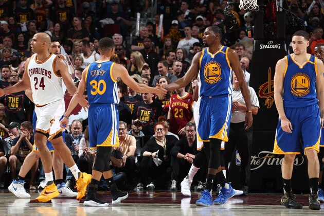 CLEVELAND, OH - JUNE 7:  Stephen Curry #30 of the Golden State Warriors high fives Kevin Durant #25 during the game against the Cleveland Cavaliers in Game Three of the 2017 NBA Finals on June 7, 2017 at Quicken Loans Arena in Cleveland, Ohio. NOTE TO USER: User expressly acknowledges and agrees that, by downloading and or using this photograph, user is consenting to the terms and conditions of Getty Images License Agreement. Mandatory Copyright Notice: Copyright 2017 NBAE (Photo by Nathaniel S. Butler/NBAE via Getty Images)