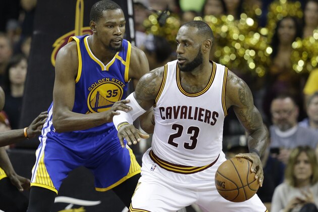 Golden State Warriors forward Kevin Durant (35) defends Cleveland Cavaliers forward LeBron James (23) during the second half of Game 3 of basketball's NBA Finals in Cleveland, Wednesday, June 7, 2017. (AP Photo/Tony Dejak)