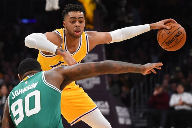 Mar 3, 2017; Los Angeles, CA, USA; Los Angeles Lakers guard D'Angelo Russell (1) gets the ball past Boston Celtics forward Amir Johnson (90) as he drives to the basket in the first half at Staples Center. Mandatory Credit: Jayne Kamin-Oncea-USA TODAY Sports