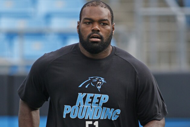 Carolina Panthers' Michael Oher warms up before an NFL football game in Charlotte, N.C., Saturday, Aug. 22, 2015. (AP Photo/Bob Leverone)