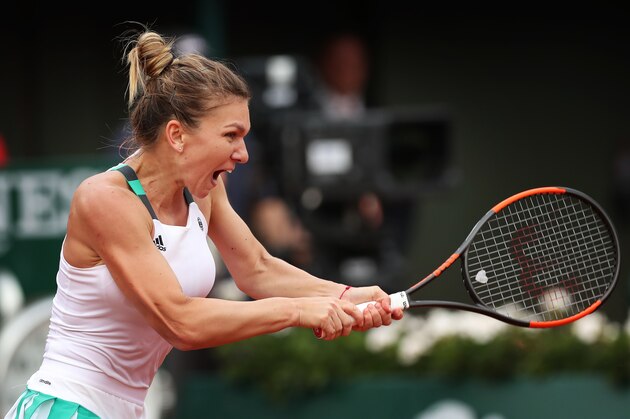 PARIS, FRANCE - JUNE 08: Simona Halep of Romania plays a backhand shot during her match with Karolina Pliskova of Czech Republic, during day twelve at Roland Garros on June 8, 2017 in Paris, France. (Photo by Ian MacNicol/Getty Images)