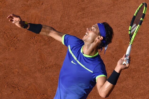 Spain's Rafael Nadal serves the ball to Austria's Dominic Thiem during their semifinal tennis match at the Roland Garros 2017 French Open on June 9, 2017 in Paris.  / AFP PHOTO / FRANCOIS XAVIER MARIT        (Photo credit should read FRANCOIS XAVIER MARIT/AFP/Getty Images)