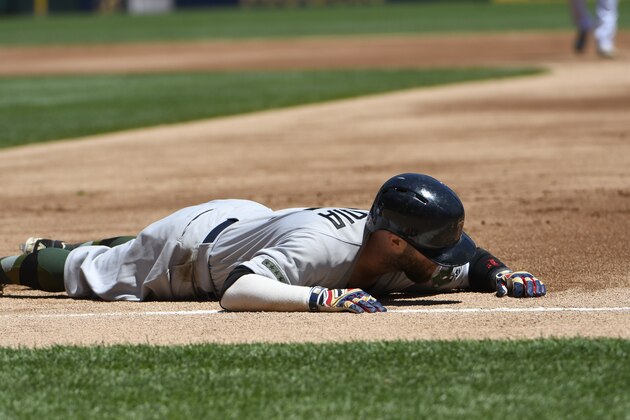CHICAGO, IL - MAY 29: Dustin Pedroia #15 of the Boston Red Sox lies on the ground after colliding with Jose Abreu #79 of the Chicago White Sox at first base during the first inning on May 29, 2017 at Guaranteed Rate Field  in Chicago, Illinois. (Photo by David Banks/Getty Images)