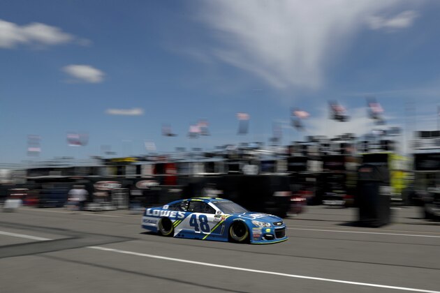 Jimmie Johnson drives through the garage area during practice for Sunday's NASCAR Cup Series Pocono 400 auto race, Friday, June 9, 2017, in Long Pond, Pa. (AP Photo/Matt Slocum)