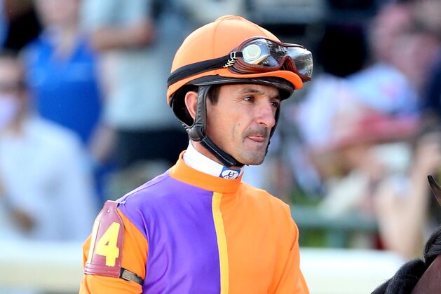 LOUISVILLE, KY - MAY 03:  Medal Count #14, ridden by Robby Albarado, takes part in the post parade prior the 140th running of the Kentucky Derby at Churchill Downs on May 3, 2014 in Louisville, Kentucky.  (Photo by Matthew Stockman/Getty Images)