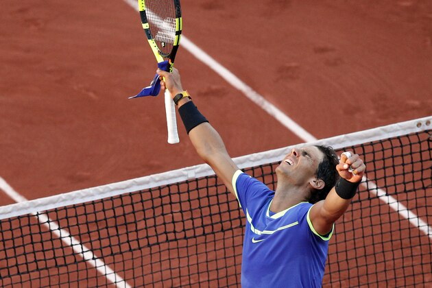 Spain's Rafael Nadal celebrates winning against Austria's Dominic Thiem during their semifinal match of the French Open tennis tournament at the Roland Garros stadium, in Paris, France, Friday, June 9, 2017. (AP Photo/Christophe Ena)