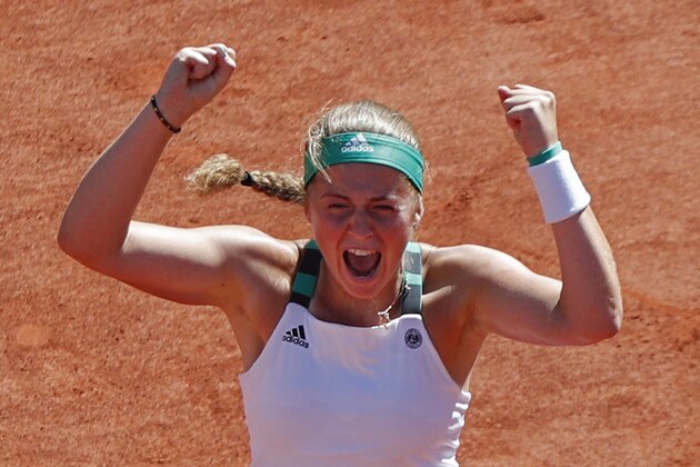 Latvia's Jelena Ostapenko celebrates winning the women's final match of the French Open tennis tournament against Romania's Simona Halep in three sets 4-6, 6-4, 6-3, at the Roland Garros stadium, in Paris, France, Saturday, June 10, 2017. (AP Photo/Christophe Ena)