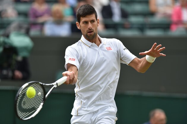Serbia's Novak Djokovic returns to US player Sam Querrey during their men's singles third round match on the sixth day of the 2016 Wimbledon Championships at The All England Lawn Tennis Club in Wimbledon, southwest London, on July 2, 2016. / AFP / GLYN KIRK / RESTRICTED TO EDITORIAL USE        (Photo credit should read GLYN KIRK/AFP/Getty Images)