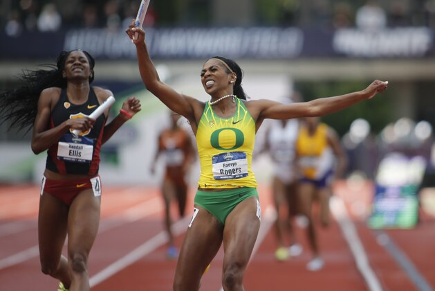Oregon's Raevyn Rogers celebrates as she crosses the finish line ahead of Southern California's Kendall Ellis to win the women's 4x400 meters relay on the final day of the NCAA outdoor college track and field championships in Eugene, Ore., Saturday, June 10, 2017. (AP Photo/Timothy J. Gonzalez)