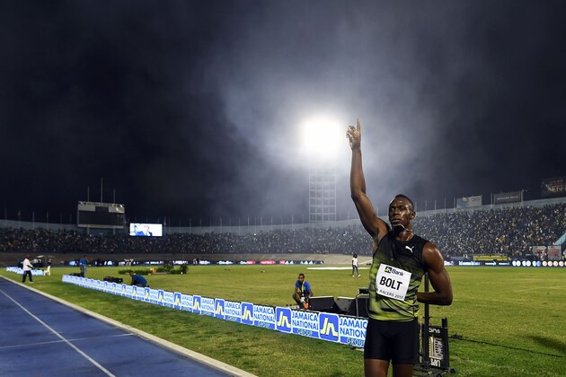 Usain Bolt of Jamaica salutes the crowd after winning 100m 'Salute to a Legend ' race during the Racers Grand Prix at the national stadium in Kingston, Jamaica, on June 10, 2017.
Bolt partied with his devoted fans in an emotional farewell at the National Stadium on June 10 as he ran his final race on Jamaican soil.
Bolt is retiring in August following the London World Championships. / AFP PHOTO / Jewel SAMAD        (Photo credit should read JEWEL SAMAD/AFP/Getty Images)