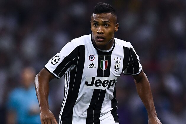 CARDIFF, WALES - JUNE 03:  Alex Sandro of Juventus runs with the ball during the UEFA Champions League Final between Juventus and Real Madrid at National Stadium of Wales on June 3, 2017 in Cardiff, Wales.  (Photo by David Ramos/Getty Images)