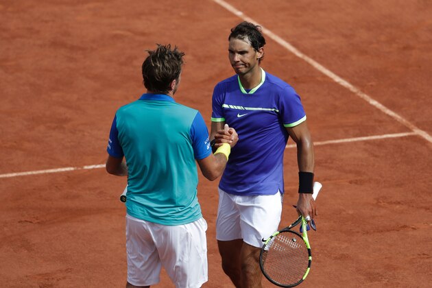 Spain's Rafael Nadal (R) shakes hands with Switzerland's Stanislas Wawrinka after winning the men's final tennis match at the Roland Garros 2017 French Open on June 11, 2017 in Paris.  / AFP PHOTO / Thomas SAMSON        (Photo credit should read THOMAS SAMSON/AFP/Getty Images)