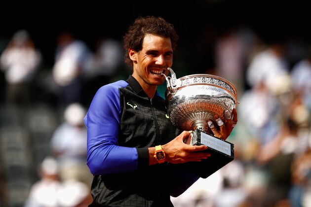 PARIS, FRANCE - JUNE 11:  Rafael Nadal of Spain celebrates victory with the trophy following the mens singles final against Stan Wawrinka of Switzerland on day fifteen of the 2017 French Open at Roland Garros on June 11, 2017 in Paris, France.  (Photo by Adam Pretty/Getty Images)