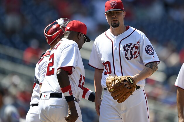 Washington Nationals relief pitcher Koda Glover, right, is pulled from a baseball game by Dusty Baker, left, during the ninth inning against the Texas Rangers, Saturday, June 10, 2017, in Washington. (AP Photo/Nick Wass)