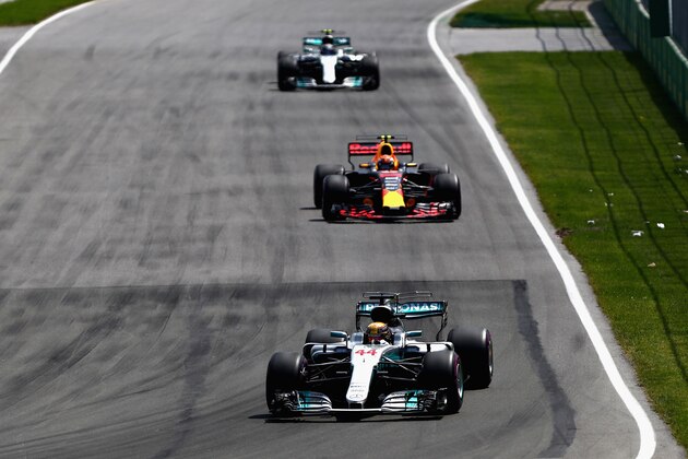 MONTREAL, QC - JUNE 11: Lewis Hamilton of Great Britain driving the (44) Mercedes AMG Petronas F1 Team Mercedes F1 WO8 leads Max Verstappen of the Netherlands driving the (33) Red Bull Racing Red Bull-TAG Heuer RB13 TAG Heuer on track during the Canadian Formula One Grand Prix at Circuit Gilles Villeneuve on June 11, 2017 in Montreal, Canada.  (Photo by Dan Istitene/Getty Images)