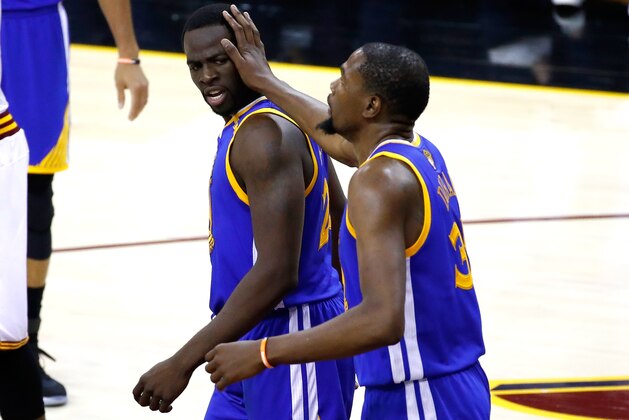 CLEVELAND, OH - JUNE 07: Draymond Green #23 and Kevin Durant #35 of the Golden State Warriors react in the first half against the Cleveland Cavaliers in Game 3 of the 2017 NBA Finals at Quicken Loans Arena on June 7, 2017 in Cleveland, Ohio. NOTE TO USER: User expressly acknowledges and agrees that, by downloading and or using this photograph, User is consenting to the terms and conditions of the Getty Images License Agreement.  (Photo by Gregory Shamus/Getty Images)