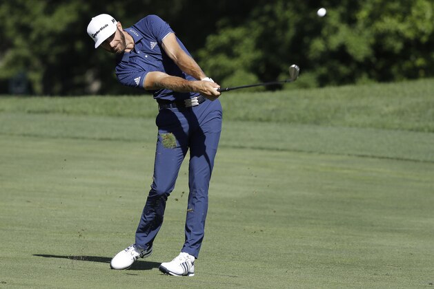 Dustin Johnson hits from the 13th fairway during the first round of the Memorial golf tournament, Thursday, June 1, 2017, in Dublin, Ohio. (AP Photo/Darron Cummings)