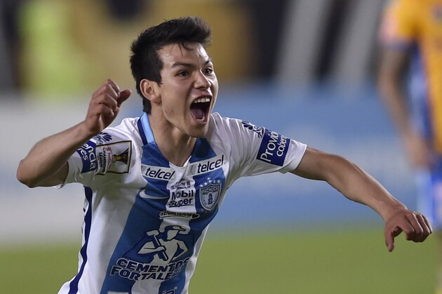 Mexico´s Pachuca Hirving Lozano (L) celebrates the goal of his teammate Franco Jara (out of frame)against Mexico´s Tigres during their CONCACAF Champions League Final match at the Hidalgo stadium in Pachuca, Hidalgo state, Mexico on April 26, 2017. / AFP PHOTO / PEDRO PARDO        (Photo credit should read PEDRO PARDO/AFP/Getty Images)