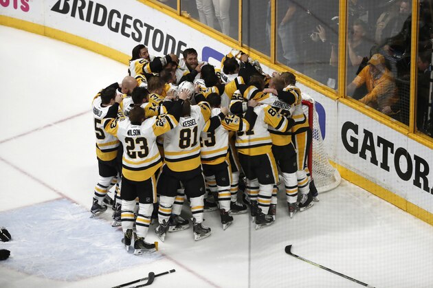 Pittsburgh Penguins players celebrate after defeating Nashville Predators 2-0 in Game 6 of the NHL hockey Stanley Cup Final, Sunday, June 11, 2017, in Nashville, Tenn. (AP Photo/Jeff Roberson)