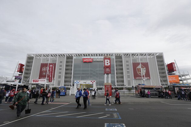 Fans walk outside of Levi's Stadium before an NFL football game between the San Francisco 49ers and the New England Patriots in Santa Clara, Calif., Sunday, Nov. 20, 2016. (AP Photo/Jeff Chiu)