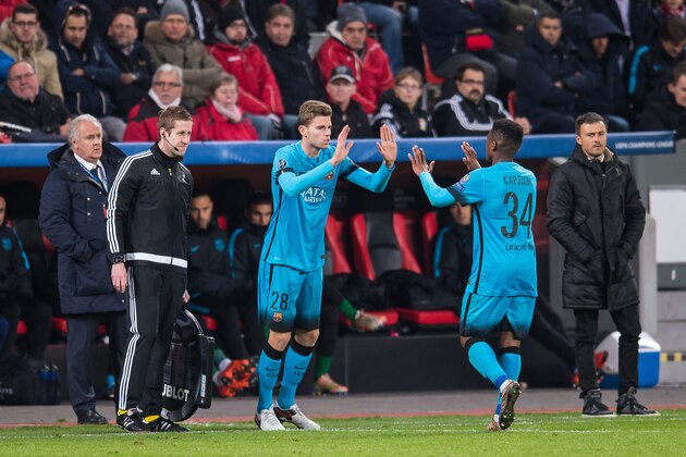 (L-R) Gerard Gumbau of FC Barcelona, Wilfrid Kaptoum of FC Barcelona, coach Luis Enrique Martinez of FC Barcelona during the UEFA Champions League match between Bayer 04 Leverkusen and FC Barcelona on December 9, 2015 at the BayArena in Leverkusen, Germany.(Photo by VI Images via Getty Images)