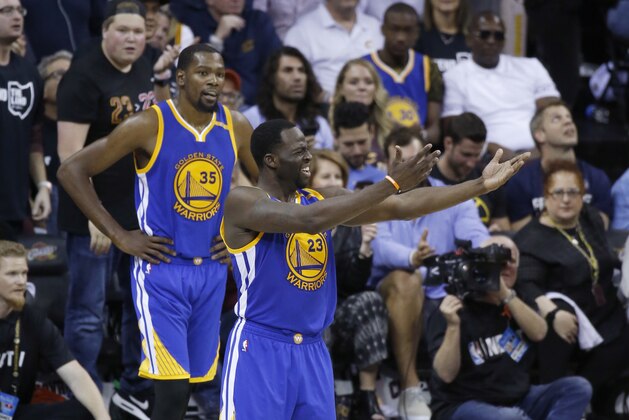 Golden State Warriors forward Draymond Green (23) gestures to fans during the second half against the Cleveland Cavaliers in Game 4 of basketball's NBA Finals in Cleveland, Friday, June 9, 2017. (AP Photo/Ron Schwane)