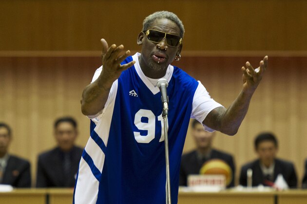 FILE - In this Jan. 8, 2014, file photo, Dennis Rodman sings Happy Birthday to North Korean leader Kim Jong Un, seated above in the stands, before an exhibition basketball game at an indoor stadium in Pyongyang, North Korea. The California Highway Patrol says former basketball player Dennis Rodman should face charges in a freeway crash. Officer Florentino Olivera told The Orange County Register  on Thursday, Aug. 4, 2016,  the agency recommends Orange County prosecutors charge Rodman with felony hit-and-run and driving the wrong way on a freeway. (AP Photo/Kim Kwang Hyon, File)