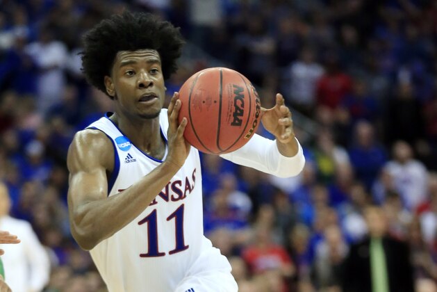 FILE - In this March 25, 2017, file photo, Kansas guard Josh Jackson pass the ball during the second half of a regional final against Oregon in the NCAA college basketball tournament in Kansas City, Mo.  The former Kansas basketball player must undergo anger management classes and apologize as part of a diversion agreement arising from a confrontation with a women's basketball player. (AP Photo/Orlin Wagner, File)