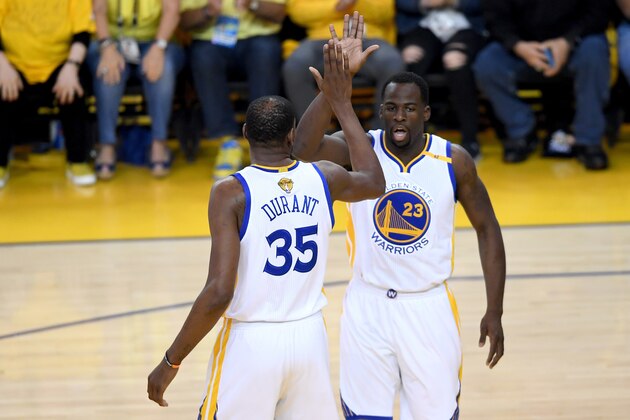 OAKLAND, CA - JUNE 12: Kevin Durant #35 and Draymond Green #23 of the Golden State Warriors react to a play in Game 5 of the 2017 NBA Finals against the Cleveland Cavaliers at ORACLE Arena on June 12, 2017 in Oakland, California. NOTE TO USER: User expressly acknowledges and agrees that, by downloading and or using this photograph, User is consenting to the terms and conditions of the Getty Images License Agreement.  (Photo by Thearon W. Henderson/Getty Images)