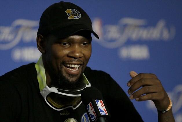 Golden State Warriors forward Kevin Durant speaks at a news conference after Game 5 of basketball's NBA Finals between the Warriors and the Cleveland Cavaliers in Oakland, Calif., Monday, June 12, 2017. The Warriors won 129-120 to win the NBA championship. (AP Photo/Ben Margot)