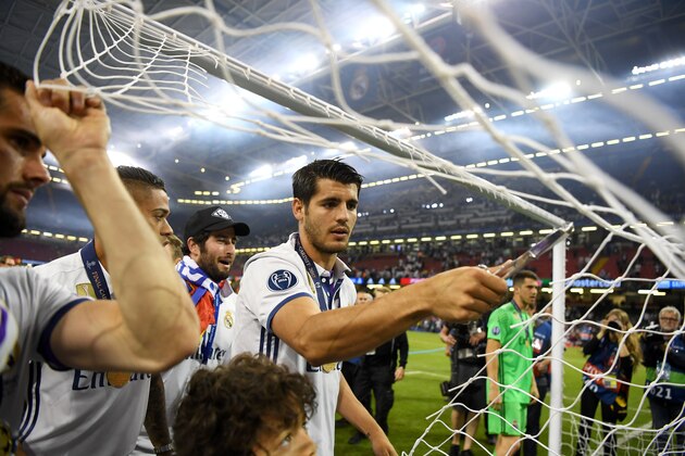 CARDIFF, WALES - JUNE 03:  Alvaro Morata of Real Madrid cuts the net after the UEFA Champions League Final between Juventus and Real Madrid at National Stadium of Wales on June 3, 2017 in Cardiff, Wales.  (Photo by Shaun Botterill/Getty Images)