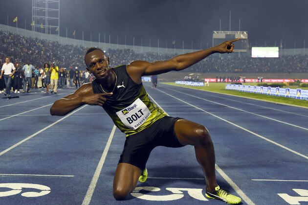 TOPSHOT - Usain Bolt (C) of Jamaica reacts after winning his final race in home country during the Racers Grand Prix at the national stadium in Kingston, Jamaica, on June 10, 2017.
Bolt partied with his devoted fans in an emotional farewell at the National Stadium on June 10 as he ran his final race on Jamaican soil.
Bolt is retiring in August following the London World Championships. / AFP PHOTO / Jewel SAMAD        (Photo credit should read JEWEL SAMAD/AFP/Getty Images)